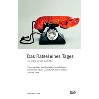 Ein roter Hummer liegt anstelle des Hörers auf einem schwarzen Wählscheibentelefon.