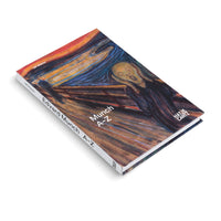Das Buch Munch A-Z von Ulf Küster, dessen Einband Edvard Munchs Gemälde Der Schrei ziert, liegt schräg auf einer weißen Oberfläche.