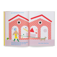 Aufgeschlagenes Kinderbuch mit einer farbenfrohen Illustration auf einer Doppelseite. Vor einem roten Backsteingebäude, dem Museum der Formen, geht eine Frau mit blauen Haaren namens Alma mit ihrem kleinen Hund Max an einer langen grünen Leine. Durch die Torbögen des Museums sind bunte geometrische Formen zu sehen. Deutscher Text beschreibt die Szene.